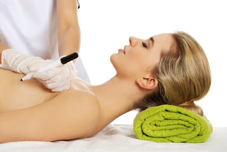 woman getting breast revision surgery